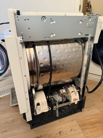 Dryer drum and motor exposed for service