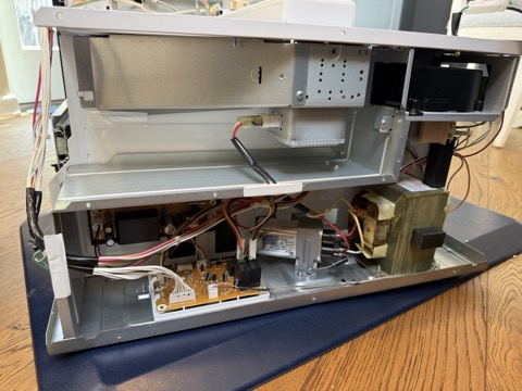 Built-in microwave with the cover off