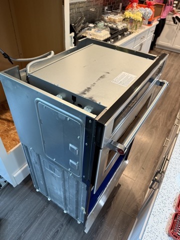 Wall oven slid out of the cabinet